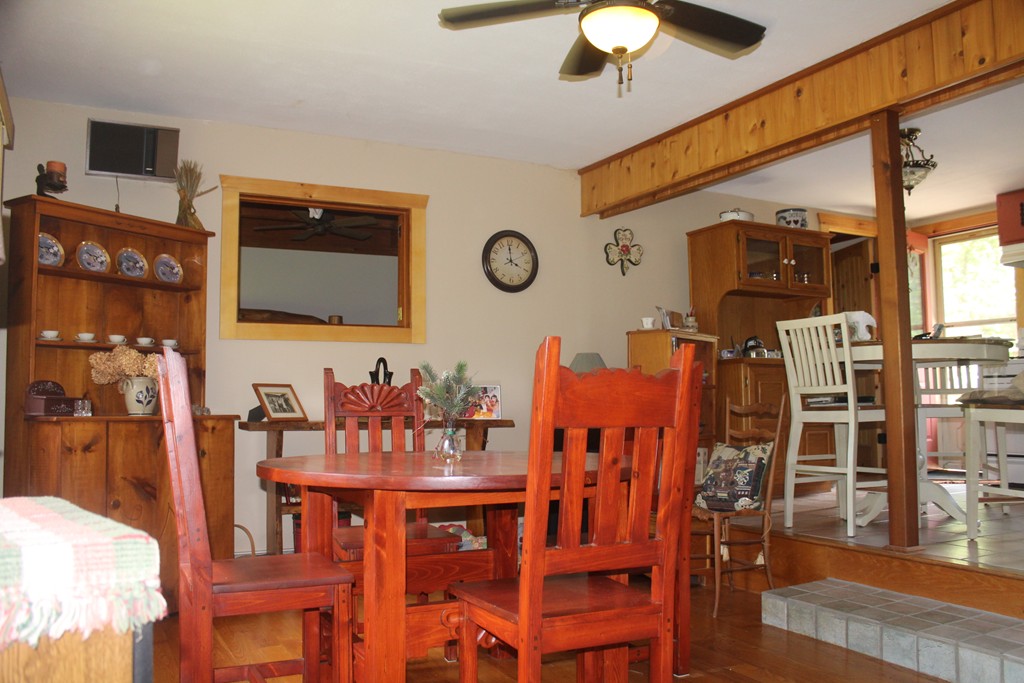 49 Quarry Road Granby, CT 06035 - Photo 19 of 25 a view of a dining room with furniture and chandelier