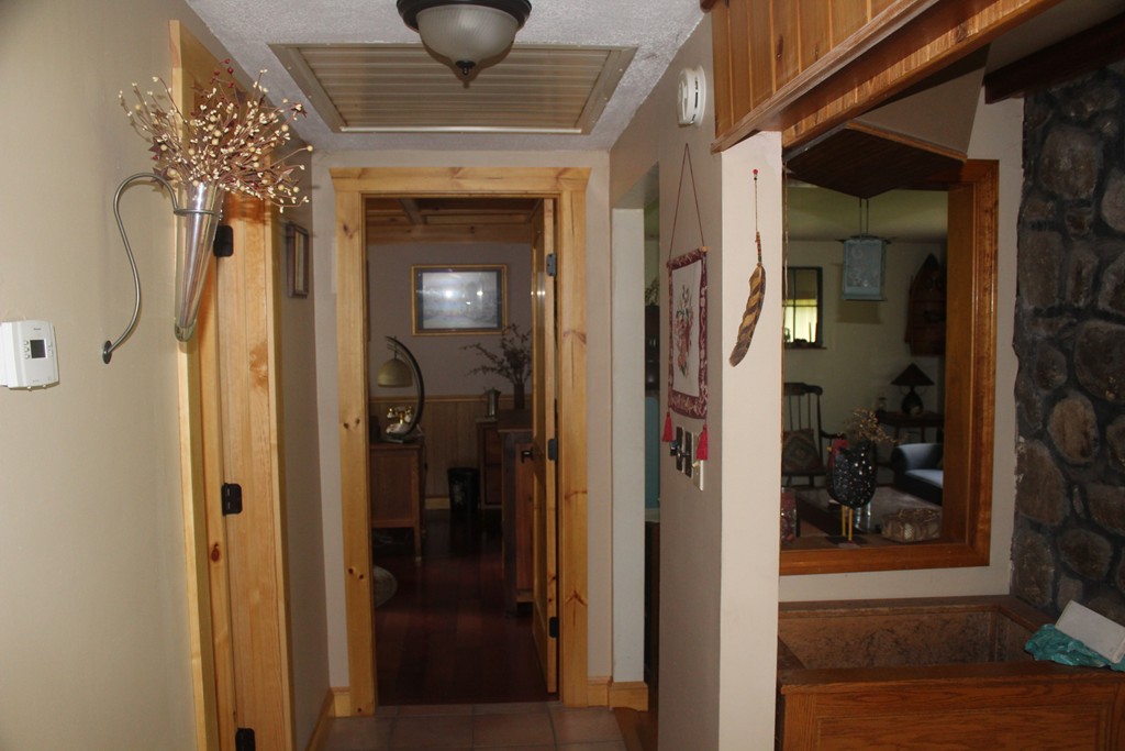 49 Quarry Road Granby, CT 06035 - Photo 22 of 25 a view of a hallway with a dining room and hallway