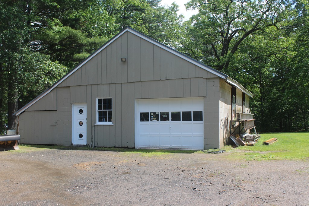 49 Quarry Road Granby, CT 06035 - Photo 3 of 25 a view of a house with a yard and garage