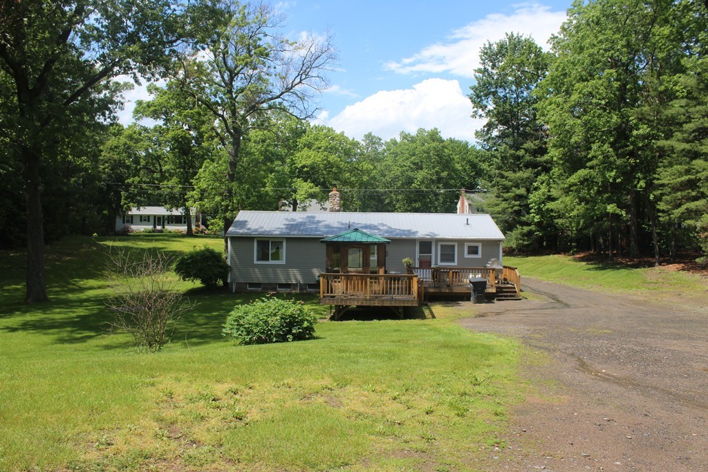49 Quarry Road Granby, CT 06035 - Photo 4 of 25 a view of a house with backyard and sitting area