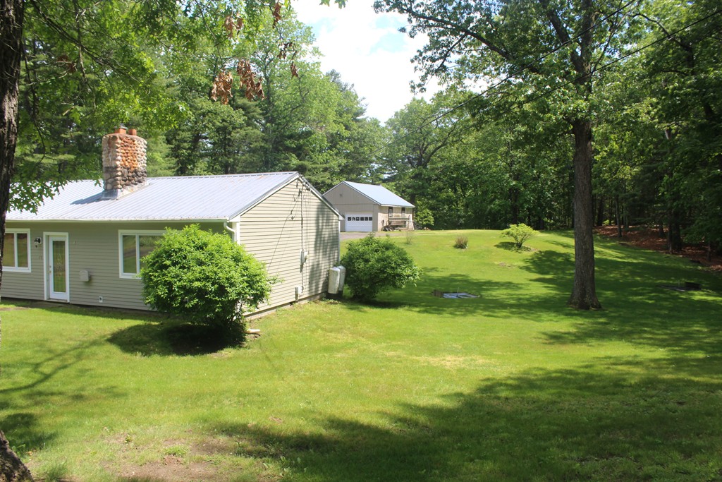 49 Quarry Road Granby, CT 06035 - Photo 6 of 25 a view of a house with a yard