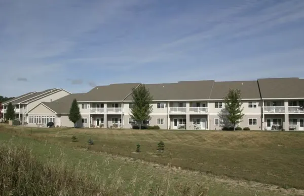a front view of residential houses with yard
