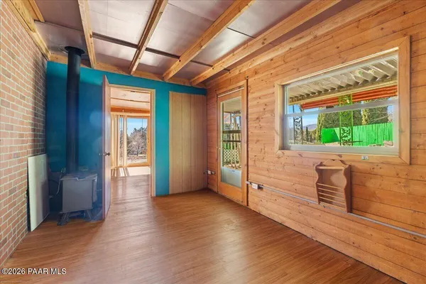 a view of an entryway with wooden floor and windows