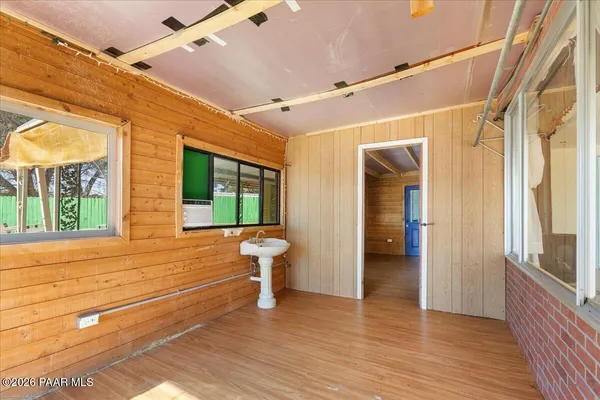 a front view of a house with a fountain