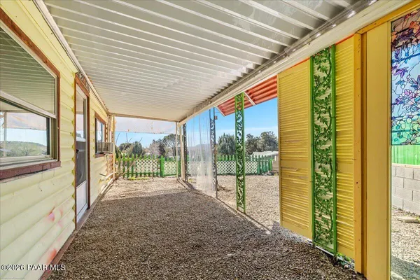 a view of a porch with a garden