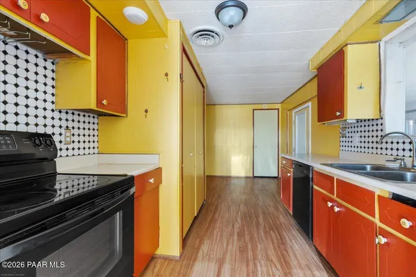 a kitchen with stainless steel appliances granite countertop a stove and a sink