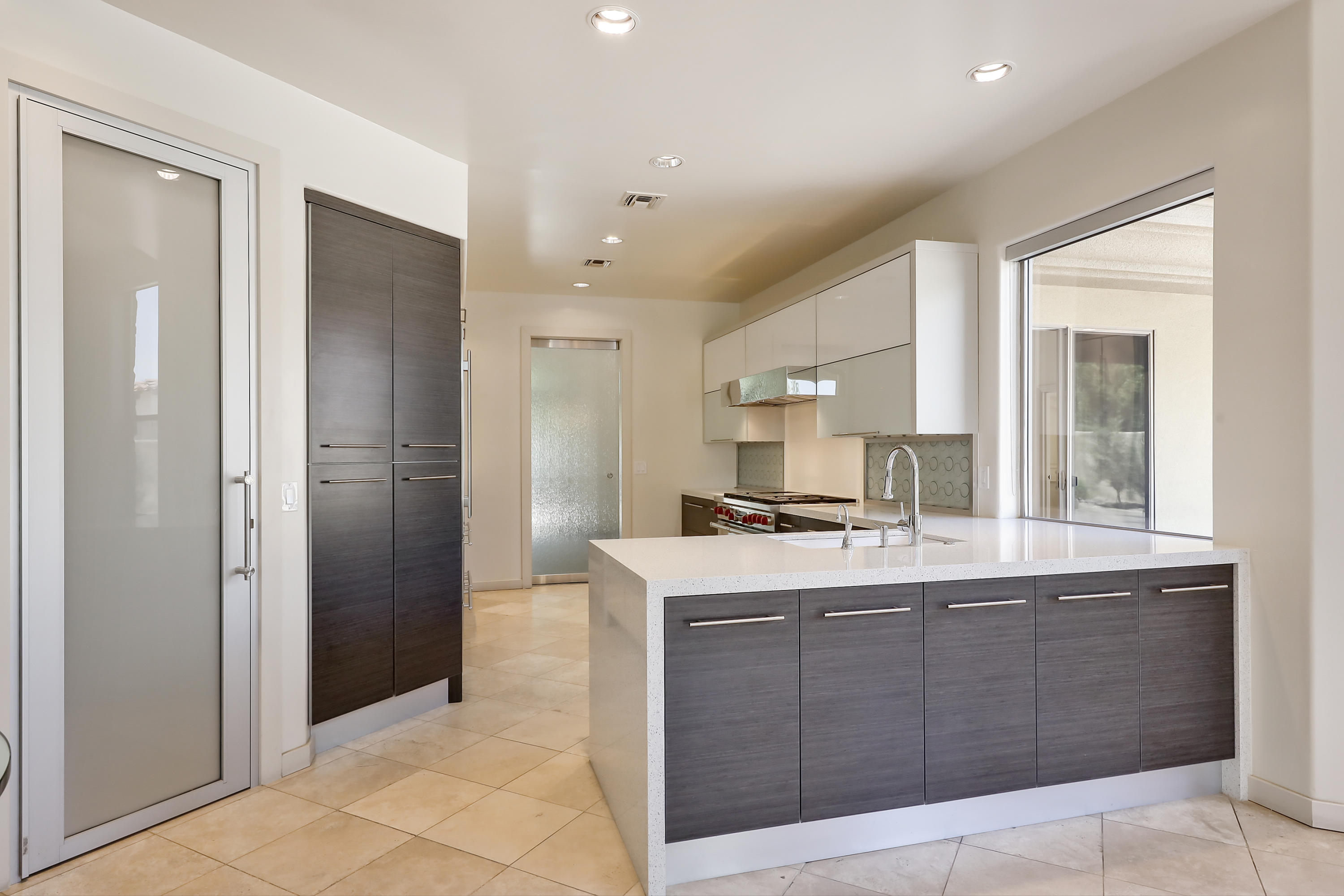 28 Clancy Lane South Rancho Mirage, CA 92270 - Photo 13 of 30 a kitchen with a sink a stove and refrigerator