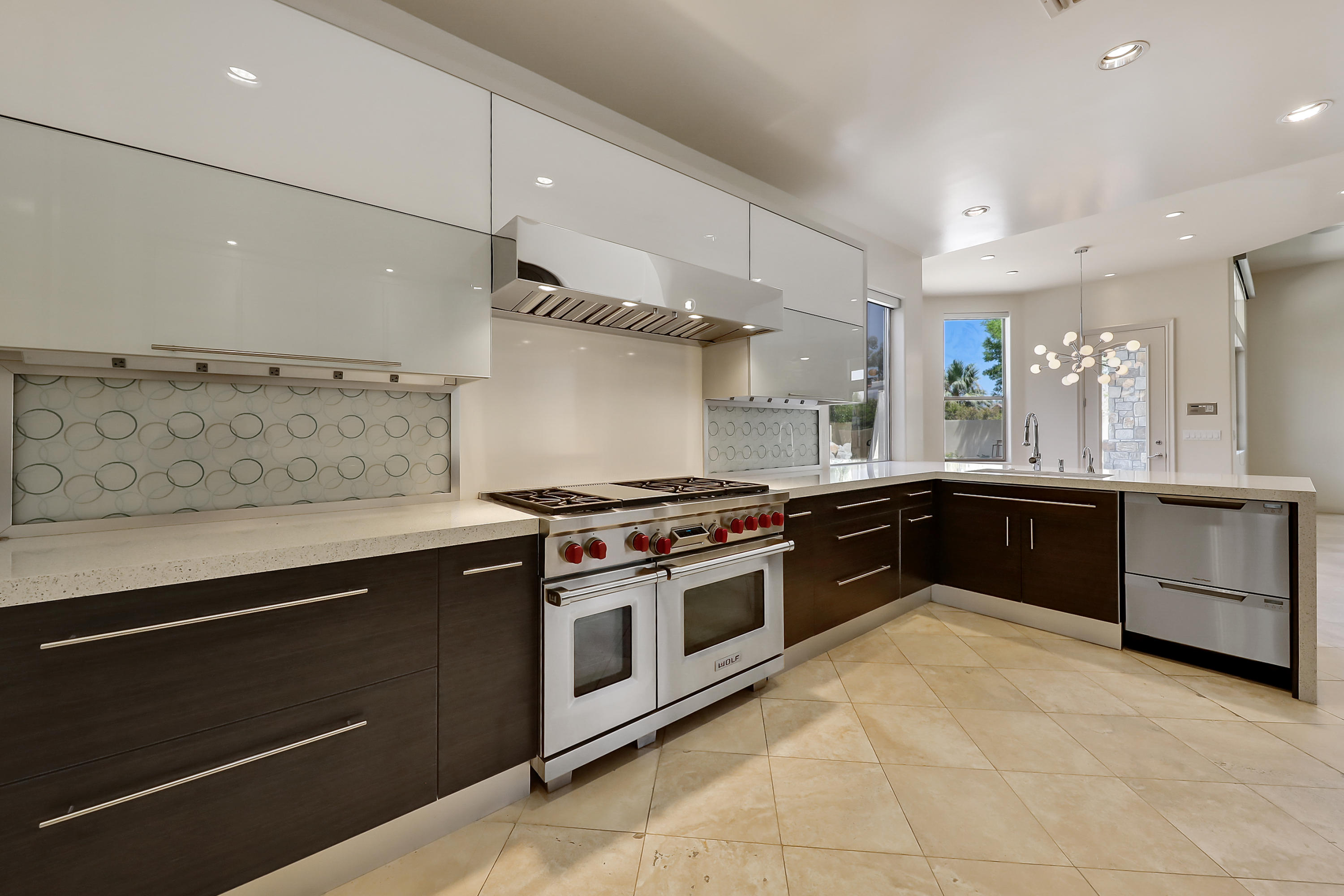 28 Clancy Lane South Rancho Mirage, CA 92270 - Photo 14 of 30 a kitchen with stainless steel appliances granite countertop a stove and a sink
