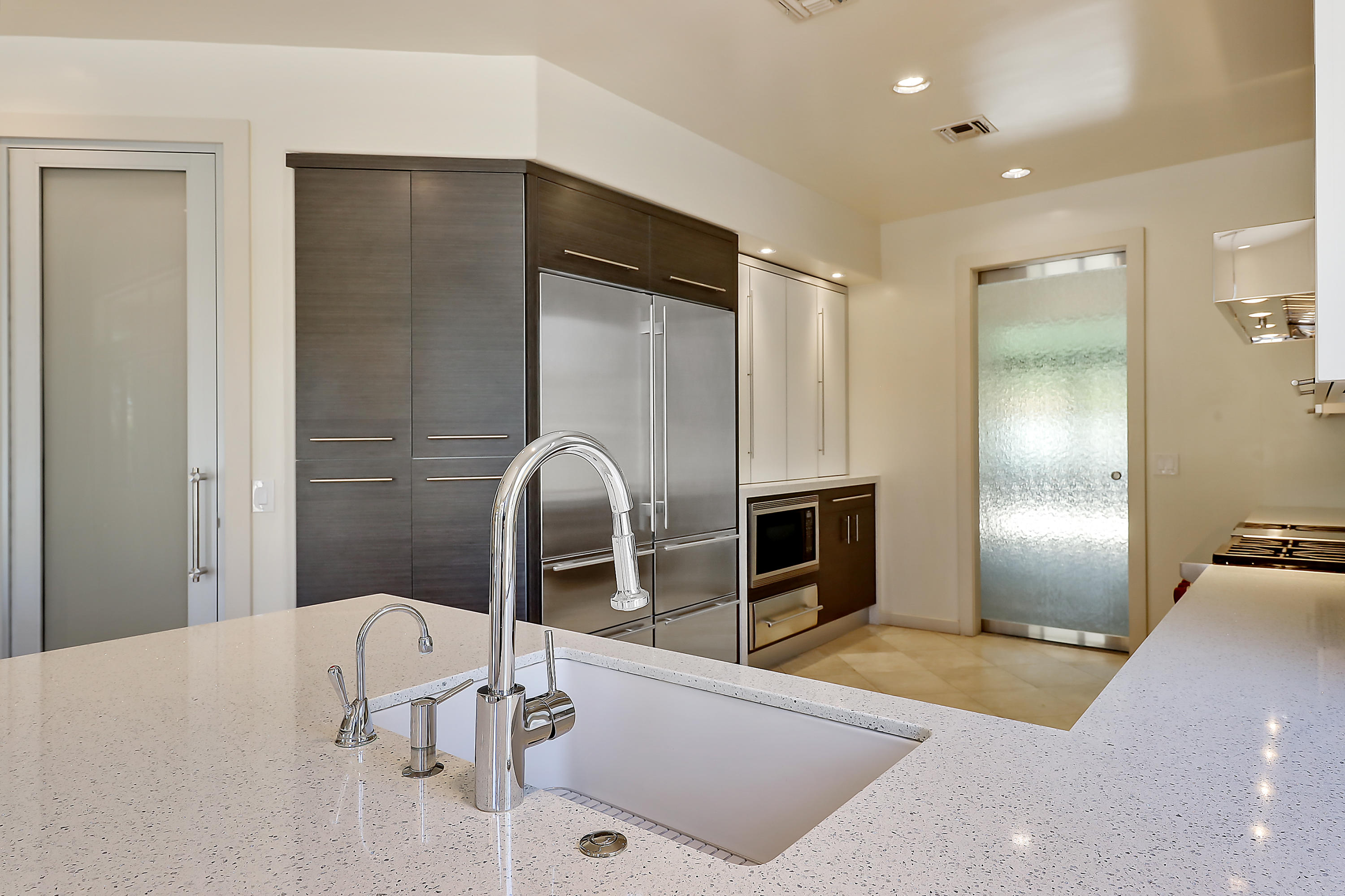 28 Clancy Lane South Rancho Mirage, CA 92270 - Photo 15 of 30 a spacious bathroom with a double vanity sink and a mirror