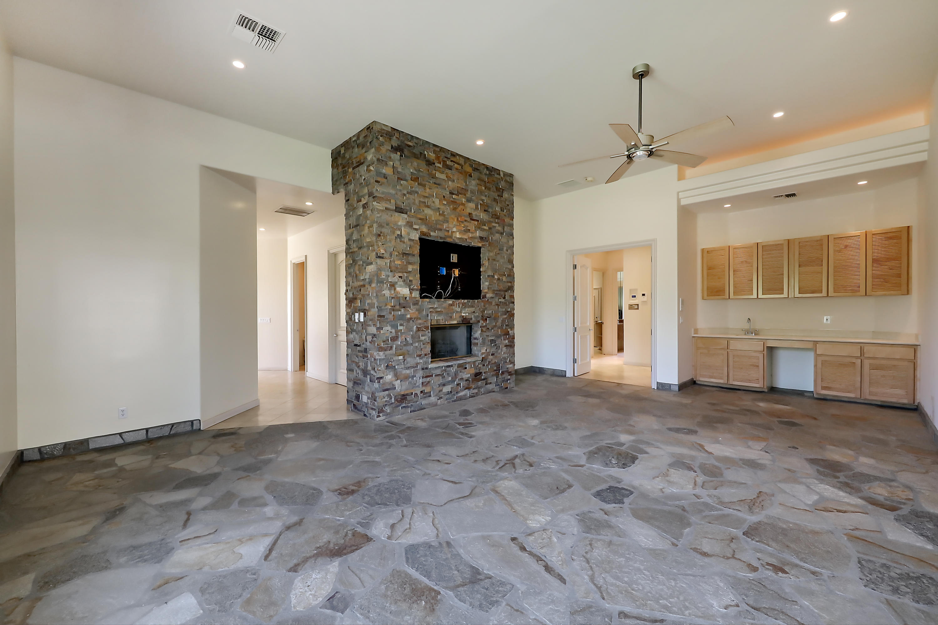 28 Clancy Lane South Rancho Mirage, CA 92270 - Photo 17 of 30 a view of an empty room with a fireplace