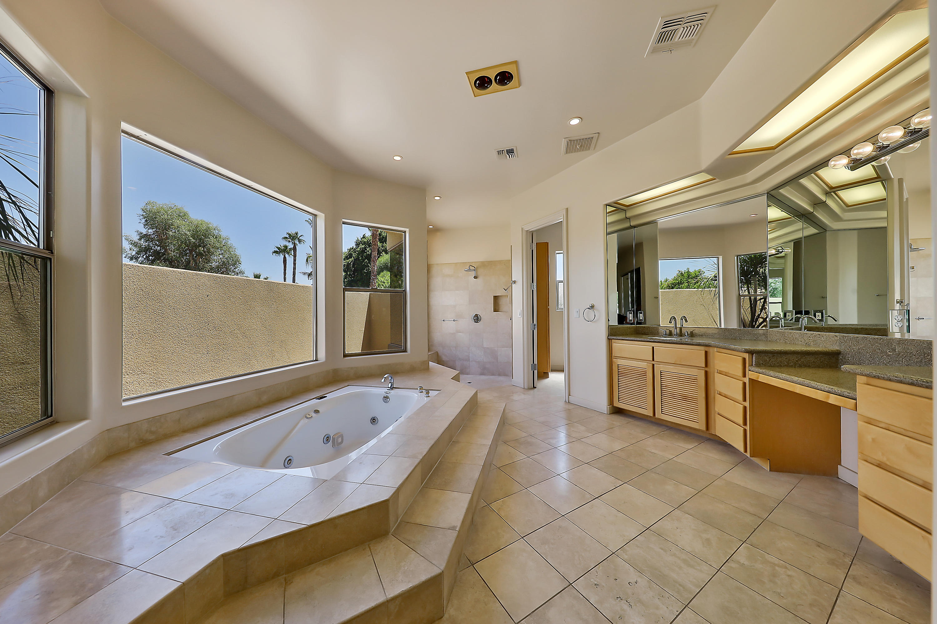 28 Clancy Lane South Rancho Mirage, CA 92270 - Photo 18 of 30 a large spacious bathroom with a large tub shower and sink