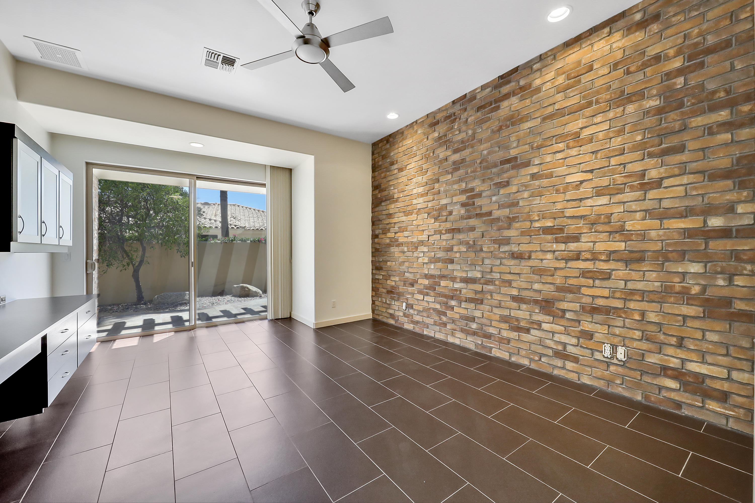 28 Clancy Lane South Rancho Mirage, CA 92270 - Photo 19 of 30 a view of an empty room with a glass door