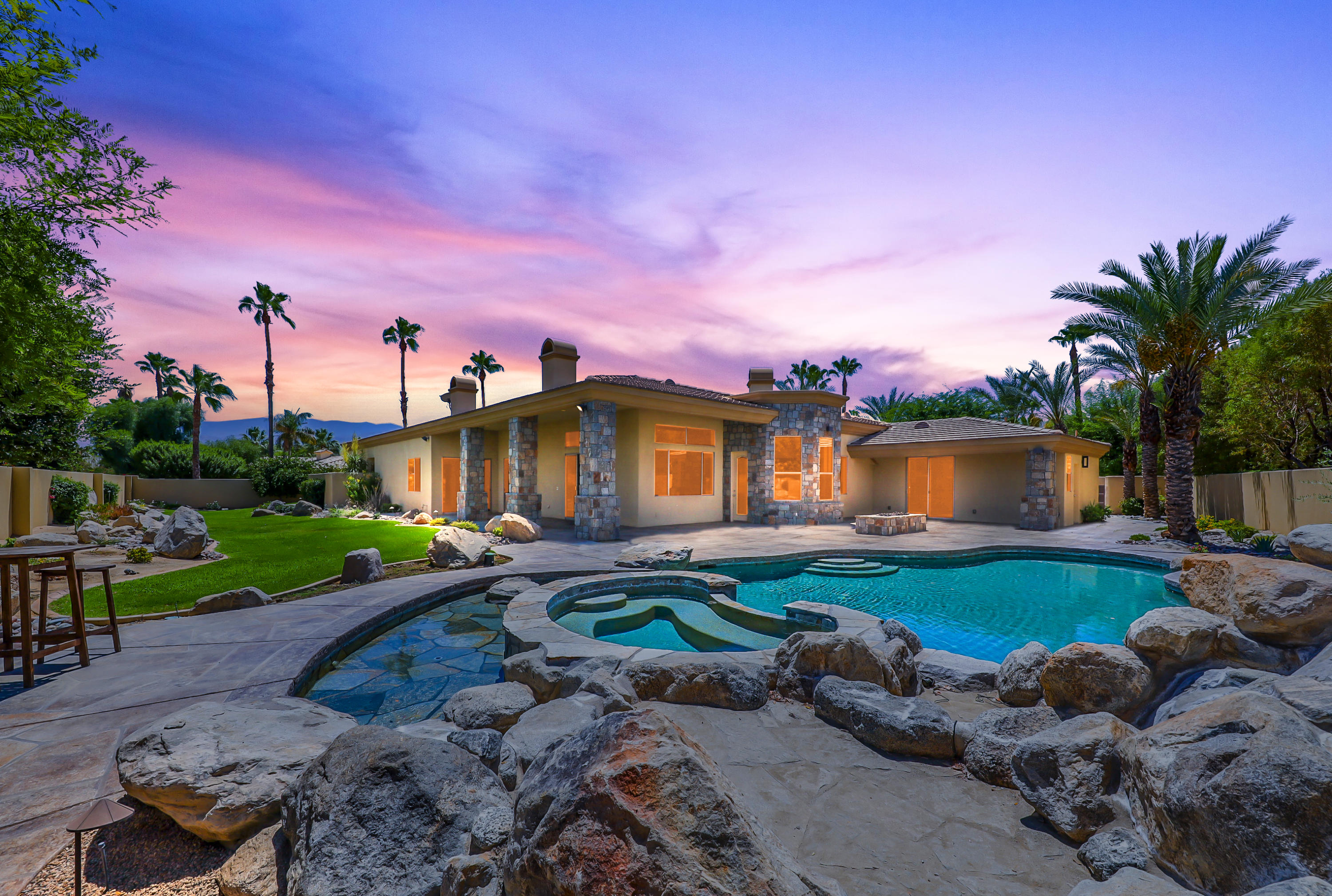 28 Clancy Lane South Rancho Mirage, CA 92270 - Photo 2 of 30 a front view of a house with garden