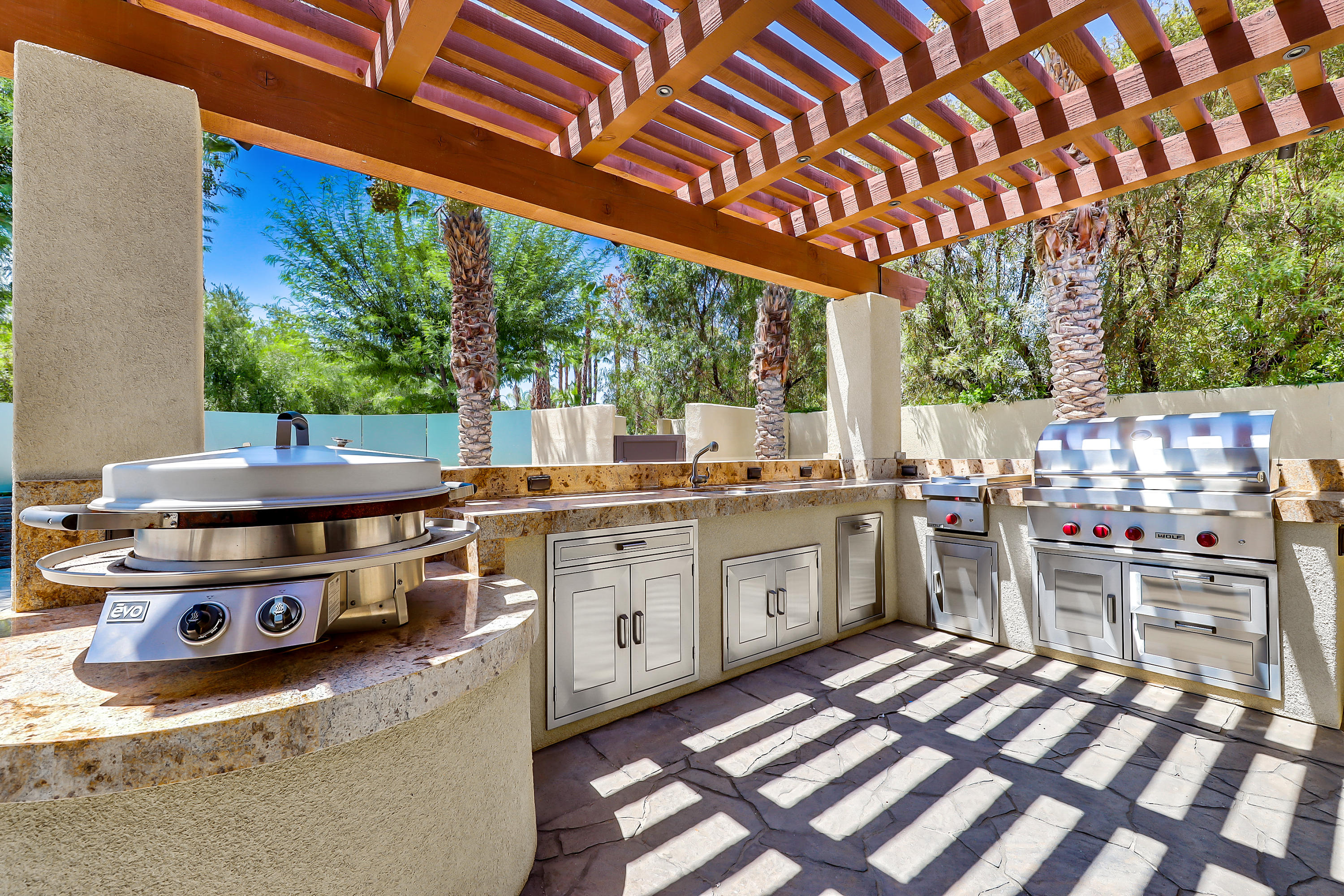 28 Clancy Lane South Rancho Mirage, CA 92270 - Photo 23 of 30 a open kitchen with stainless steel appliances granite countertop a stove a sink dishwasher and cabinets