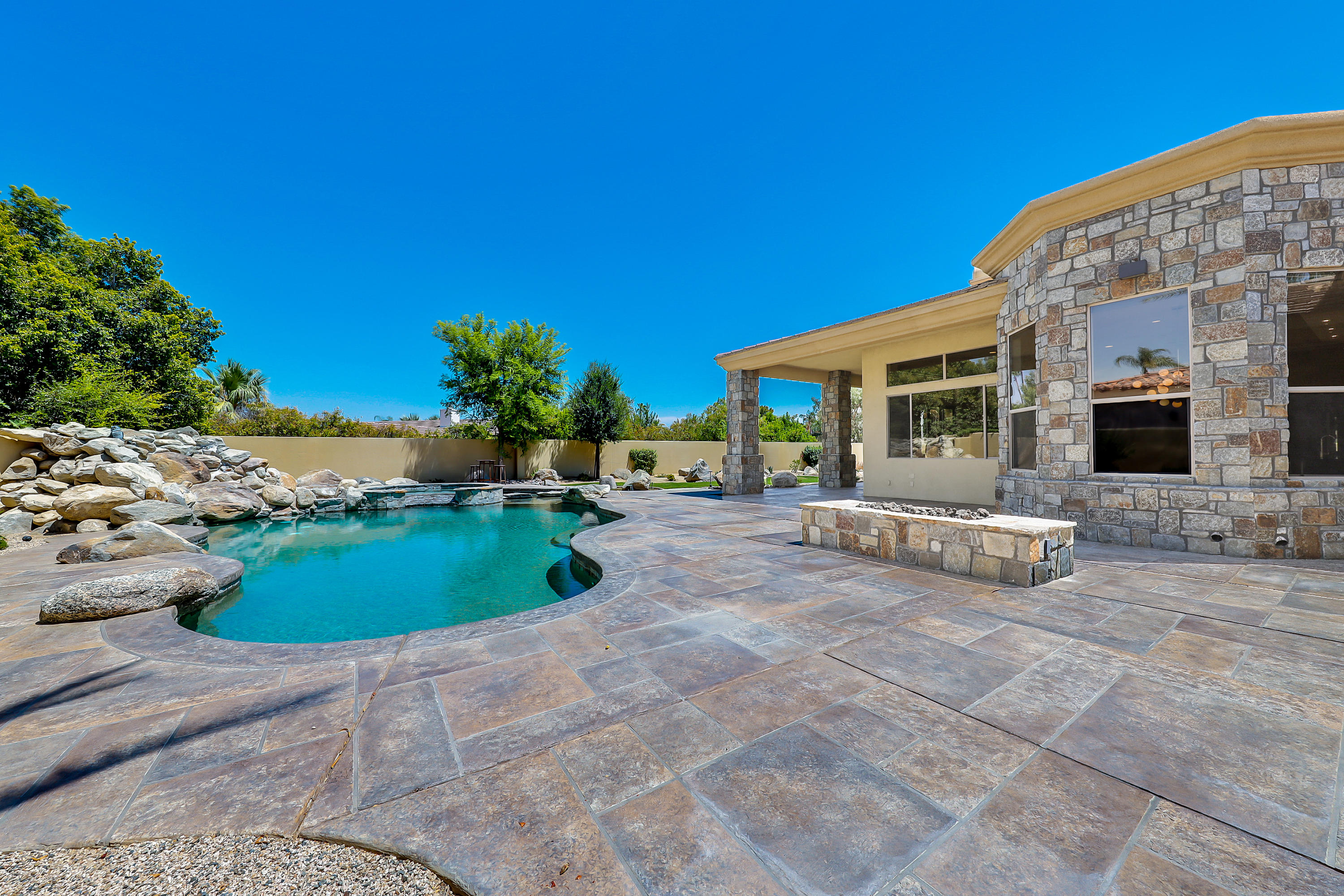 28 Clancy Lane South Rancho Mirage, CA 92270 - Photo 25 of 30 a view of backyard with outdoor seating and green space