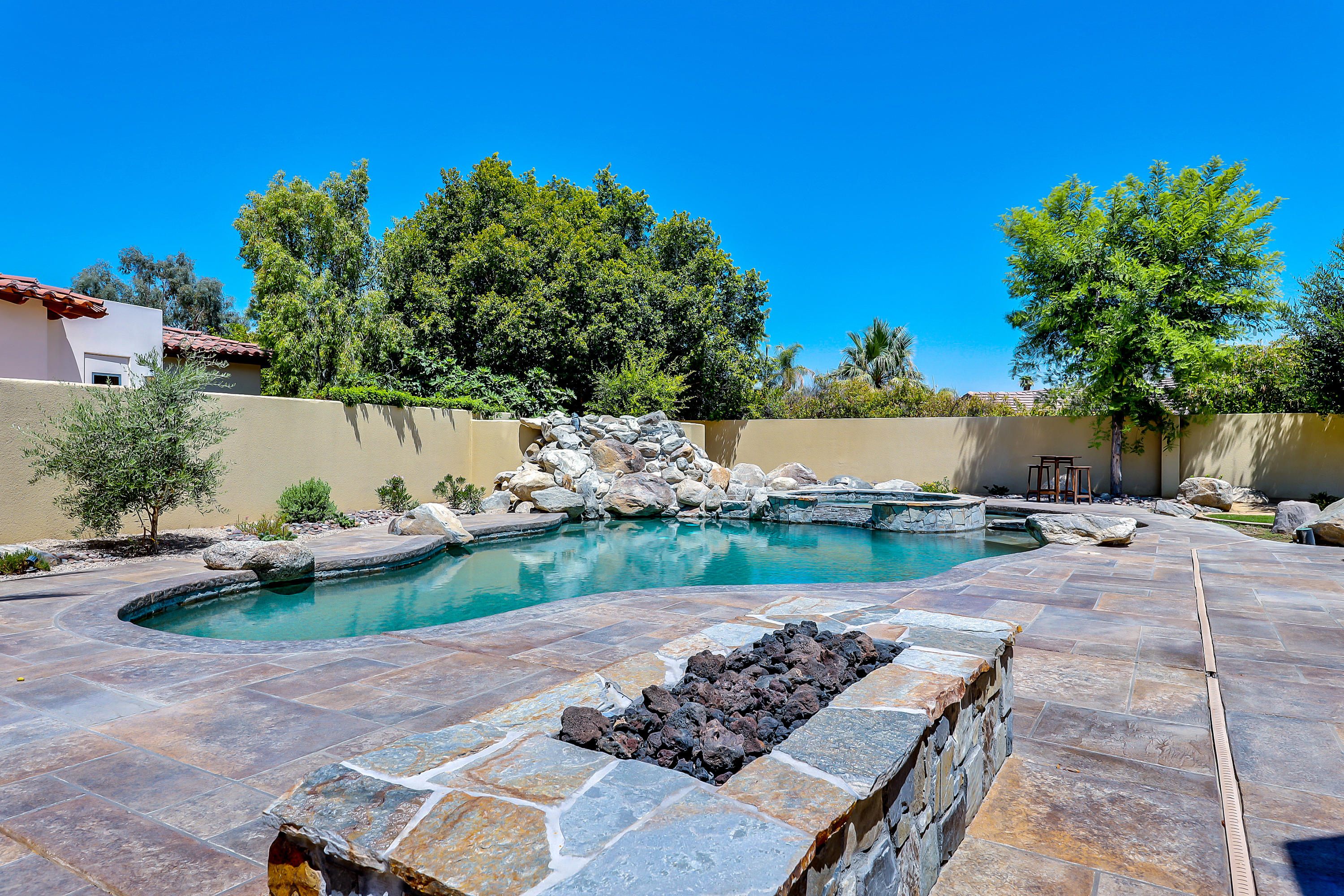 28 Clancy Lane South Rancho Mirage, CA 92270 - Photo 26 of 30 a view of backyard with outdoor seating and green space