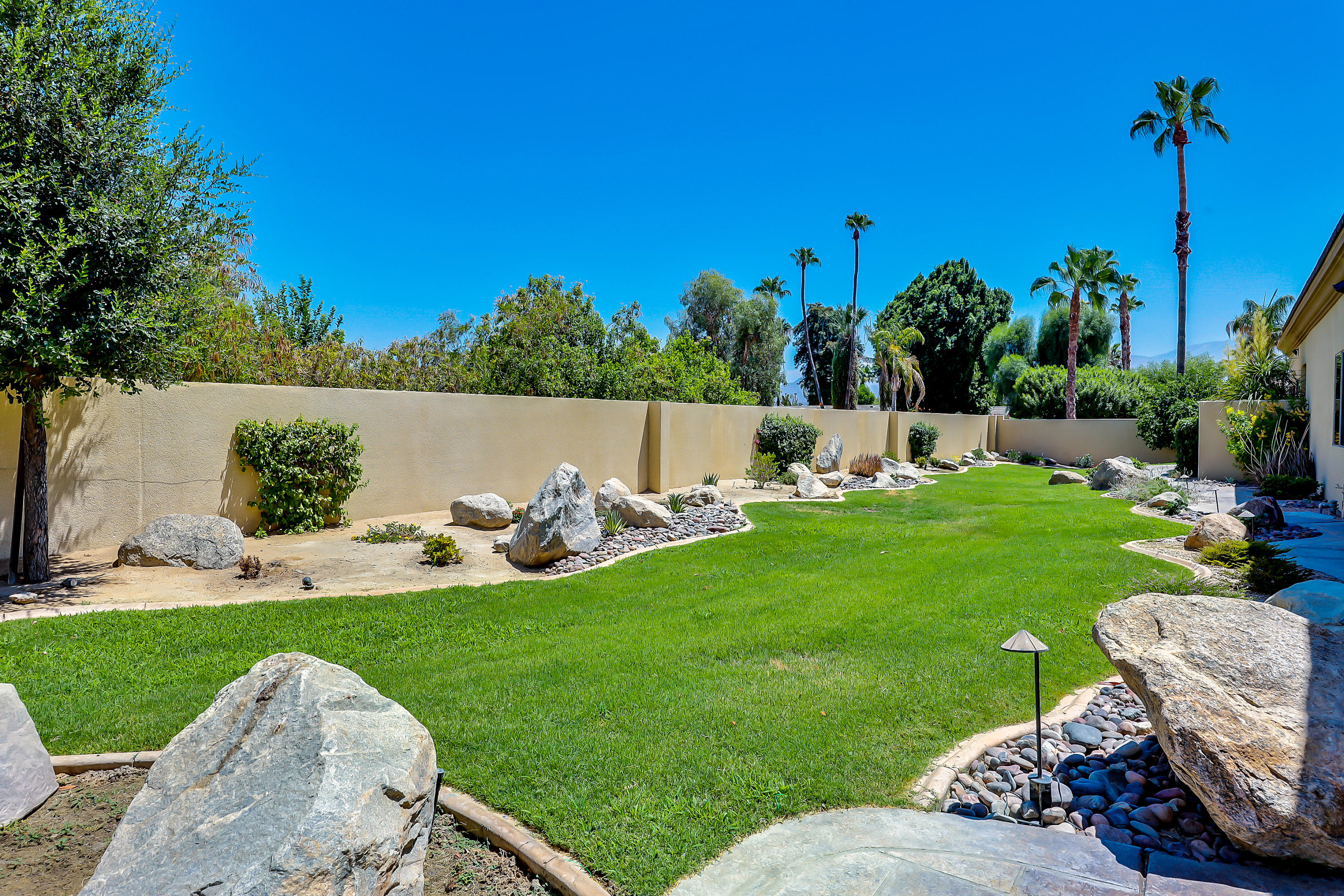 28 Clancy Lane South Rancho Mirage, CA 92270 - Photo 27 of 30 a view of a couches and lounge chairs in the yard