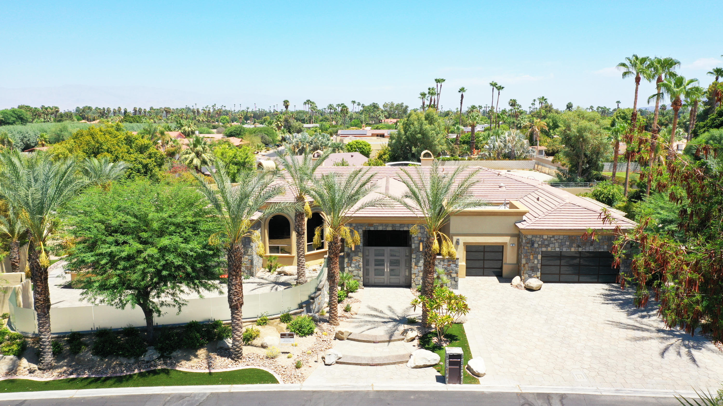 28 Clancy Lane South Rancho Mirage, CA 92270 - Photo 28 of 30 a front view of a house with a garden
