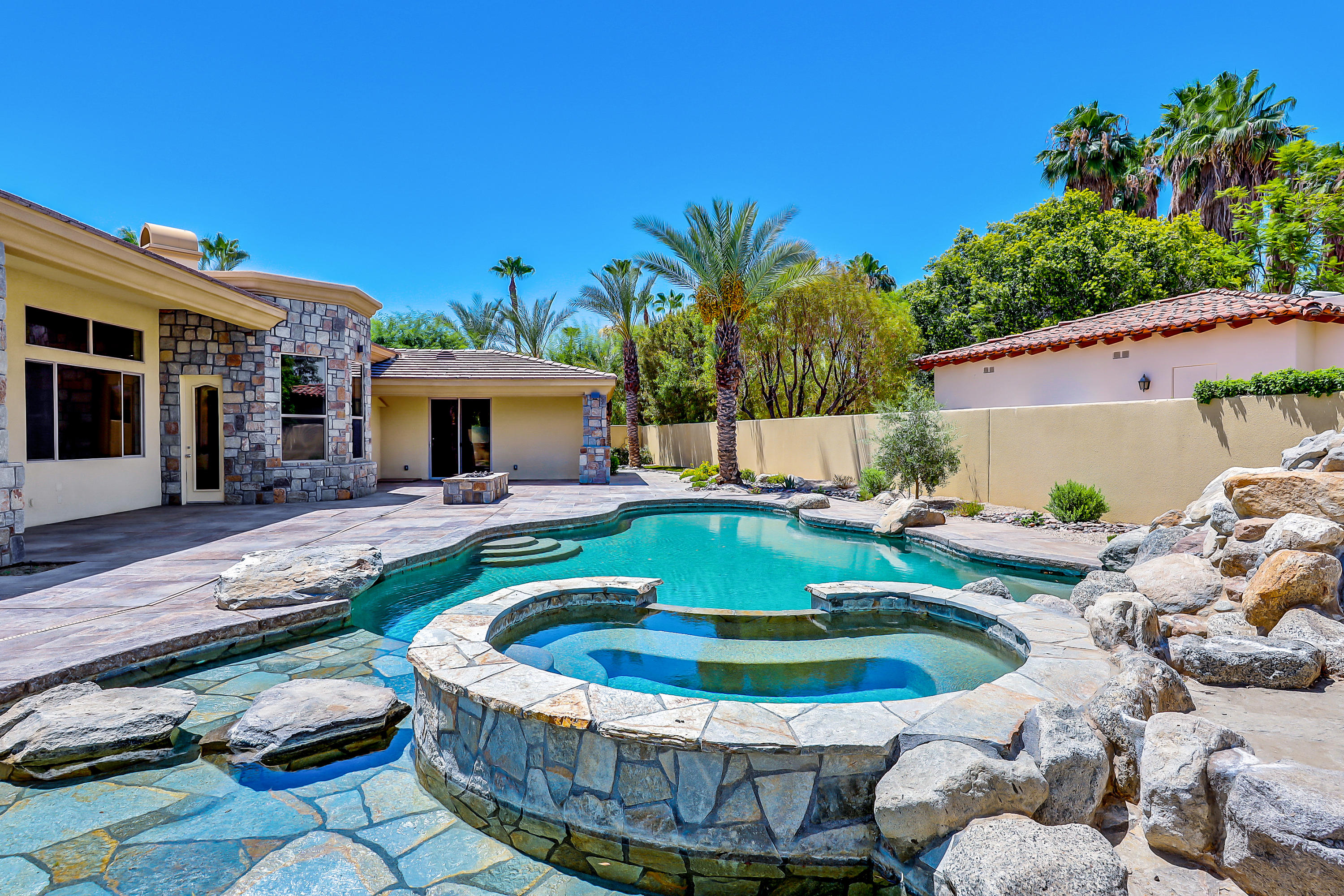 28 Clancy Lane South Rancho Mirage, CA 92270 - Photo 3 of 30 a view of a swimming pool with a patio