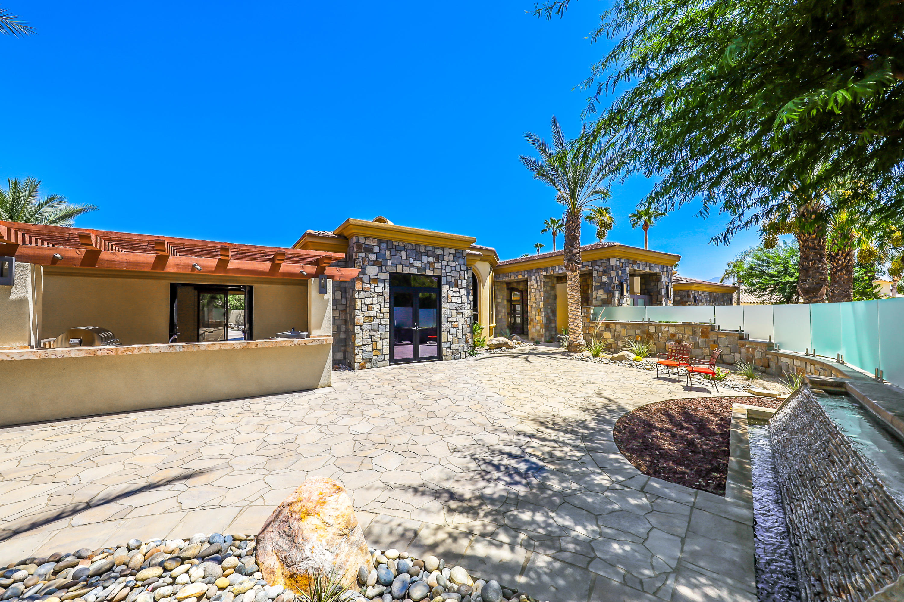 28 Clancy Lane South Rancho Mirage, CA 92270 - Photo 6 of 30 a front view of a house with a yard