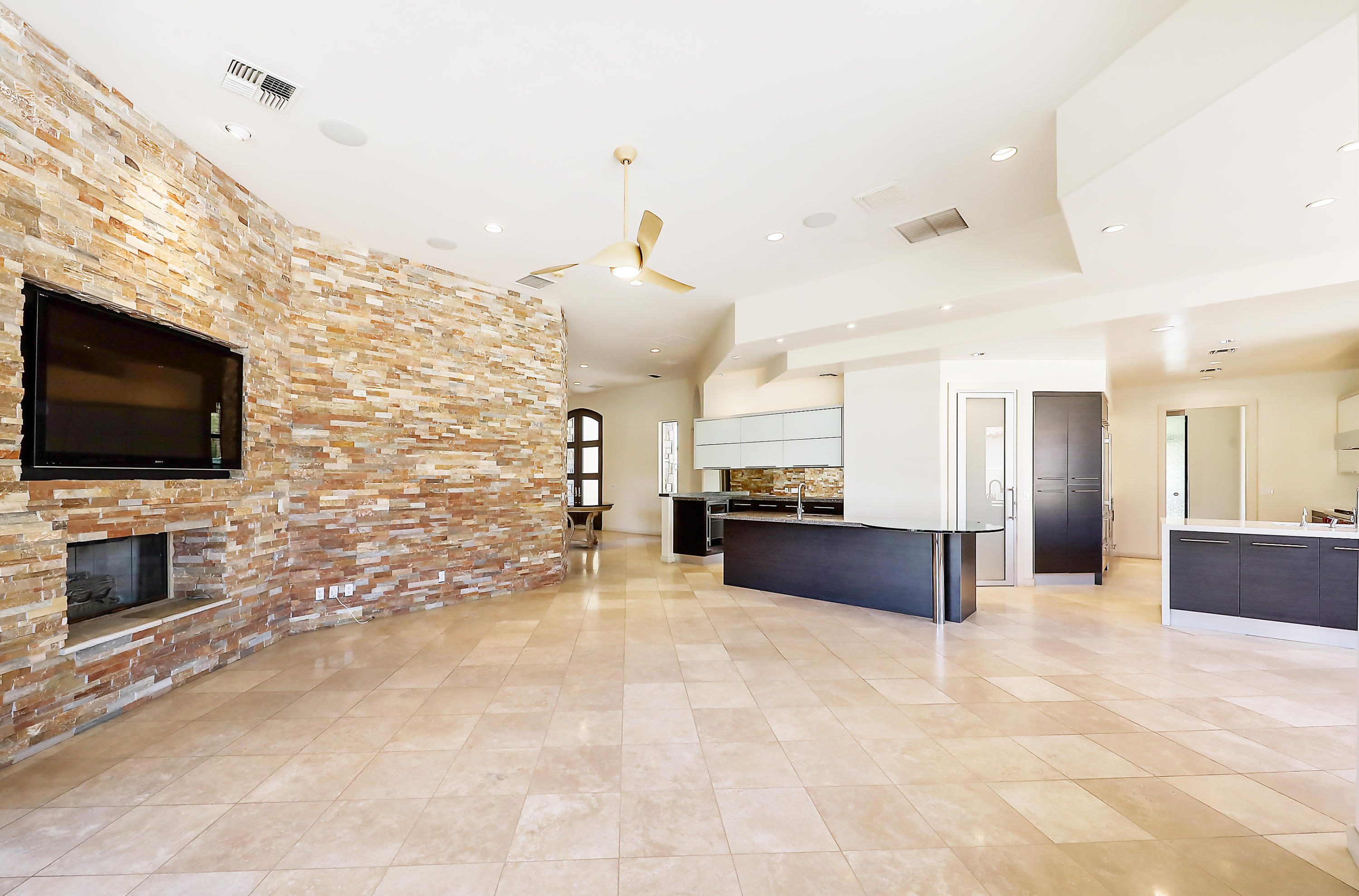 28 Clancy Lane South Rancho Mirage, CA 92270 - Photo 10 of 30 a view of living room kitchen with stainless steel appliances furniture and flat screen tv