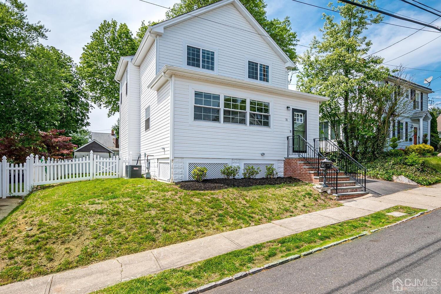 31 Carlton Street Edison, NJ 08837 - Photo 1 of 64 a view of a house with backyard and sitting area