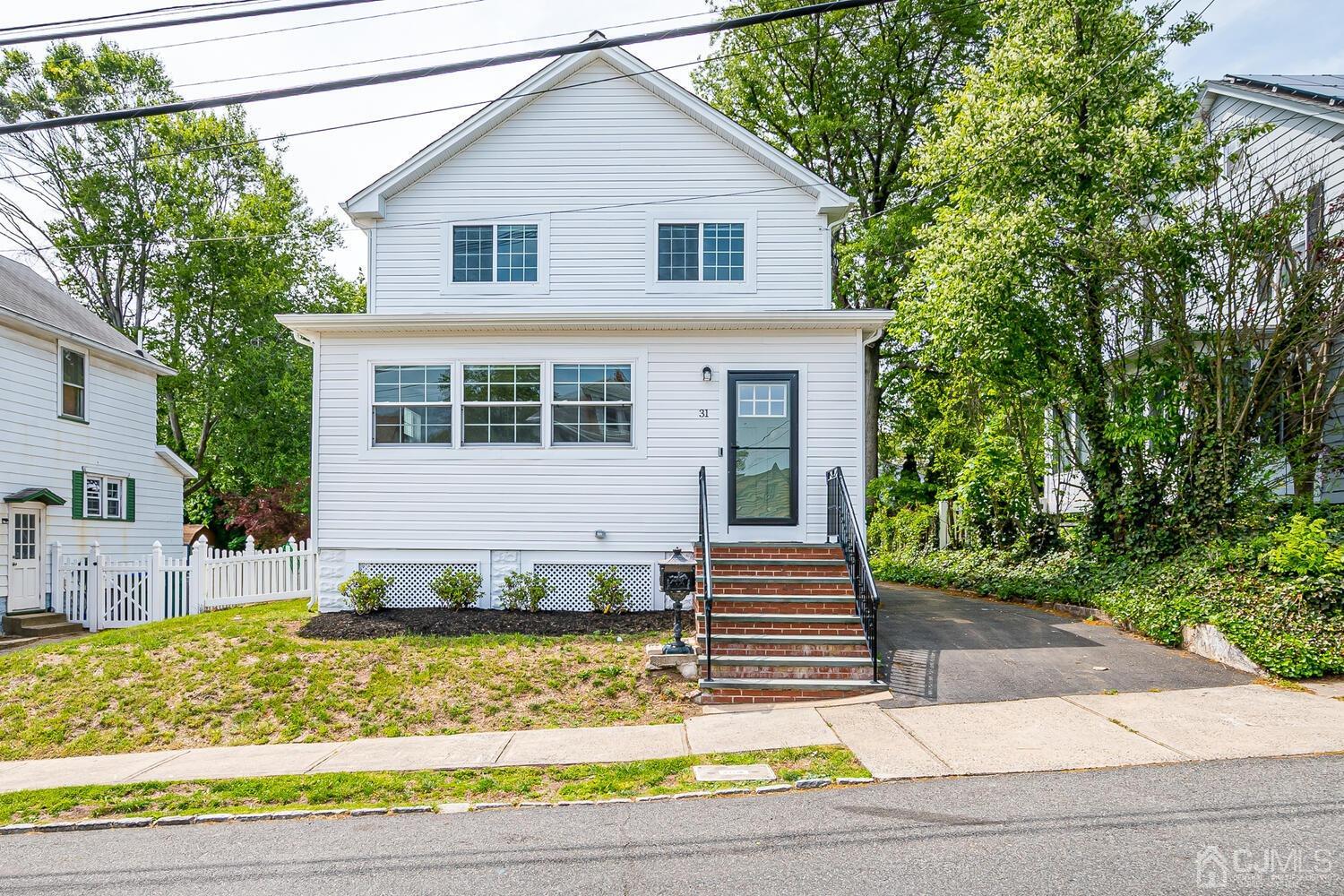 31 Carlton Street Edison, NJ 08837 - Photo 3 of 64 a view of a house with a yard plants and large tree