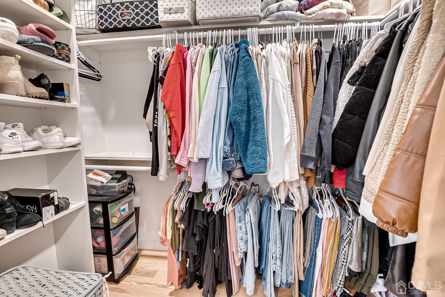 31 Carlton Street Edison, NJ 08837 - Photo 37 of 64 a view of walk in closet with clothes and shoes