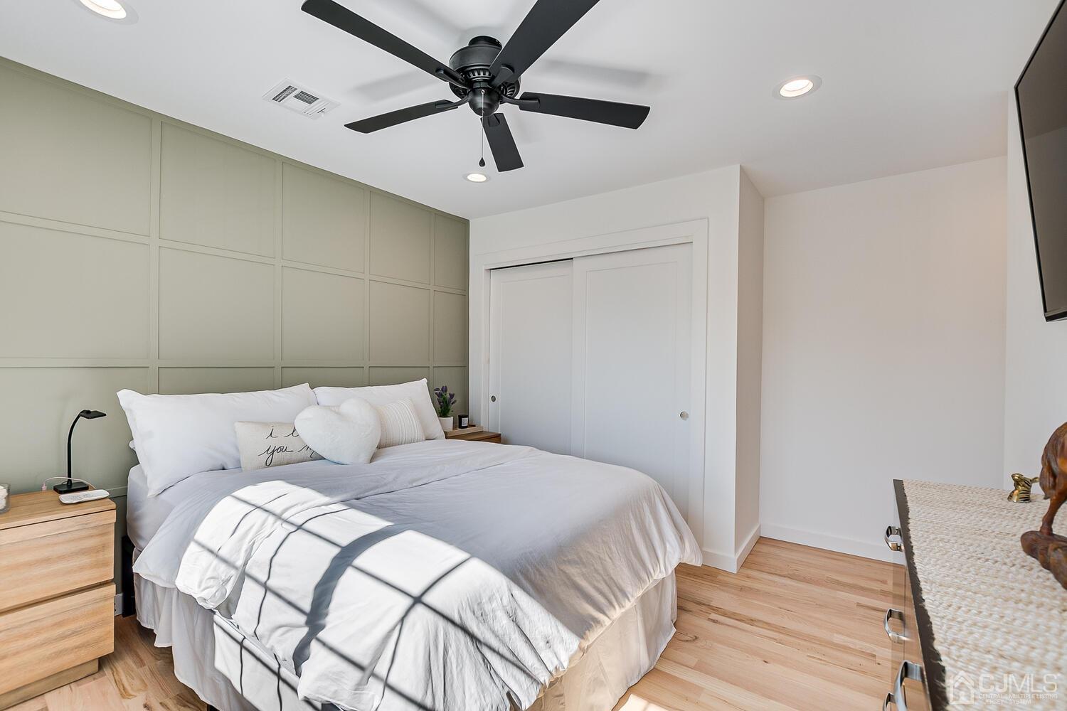 31 Carlton Street Edison, NJ 08837 - Photo 38 of 64 a bedroom with a bed and a chandelier
