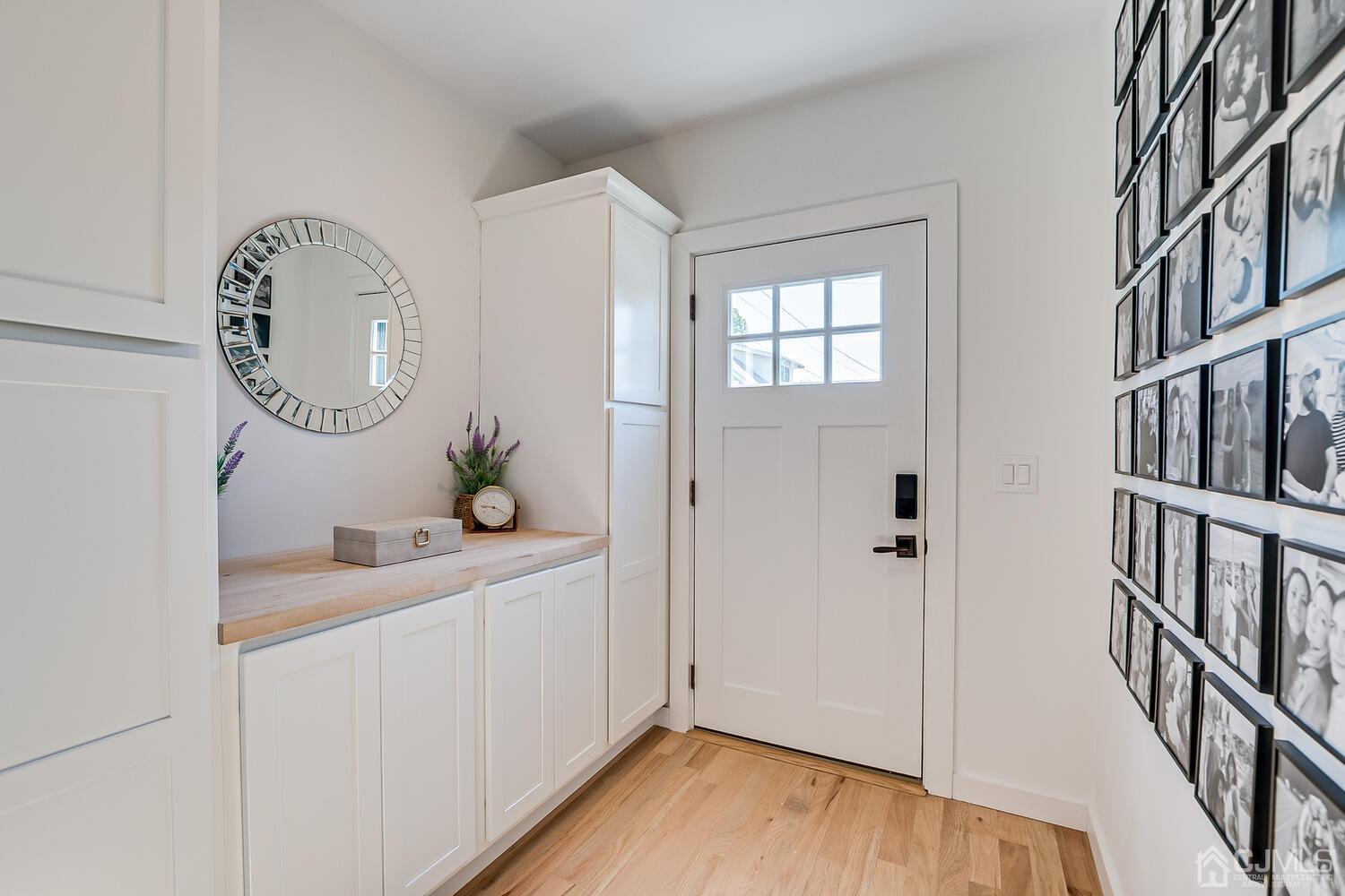 31 Carlton Street Edison, NJ 08837 - Photo 4 of 64 a white painted room with a window and wooden floor