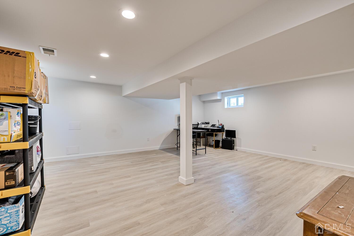 31 Carlton Street Edison, NJ 08837 - Photo 45 of 64 a view of a livingroom with wooden floor and staircase