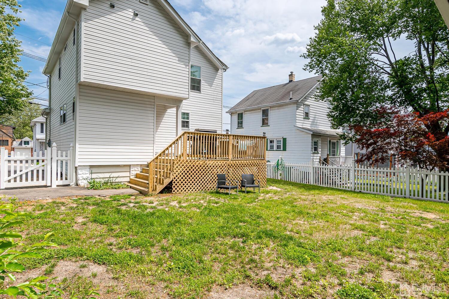 31 Carlton Street Edison, NJ 08837 - Photo 53 of 64 a view of a house with a yard and sitting area