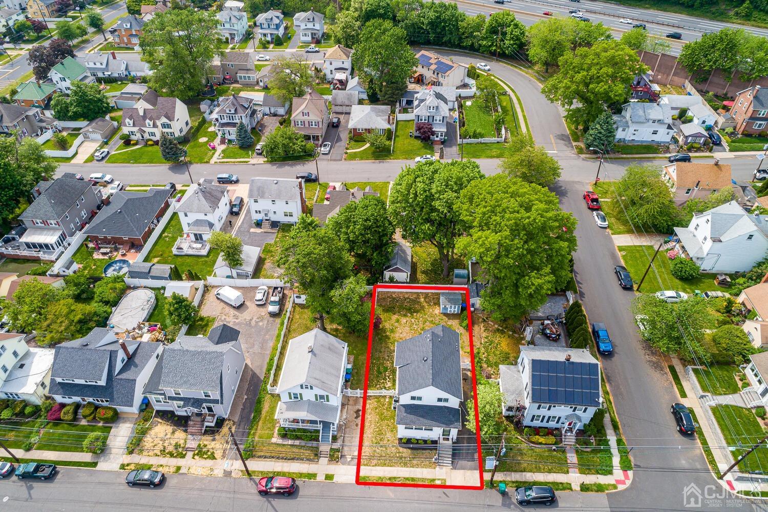 31 Carlton Street Edison, NJ 08837 - Photo 59 of 64 an aerial view of residential houses with outdoor space and parking