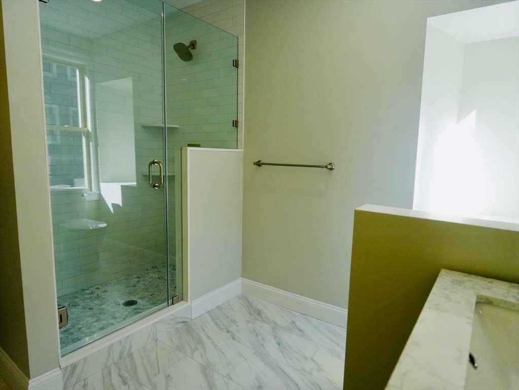 59 7th Street, Unit 1 Cambridge, MA 02141 - Photo 13 of 21 a bathroom with a bath tub and shower