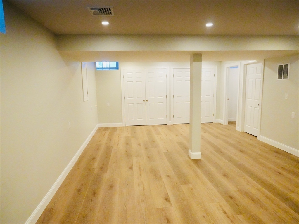 59 7th Street, Unit 1 Cambridge, MA 02141 - Photo 19 of 21 a view of a room with wooden floor