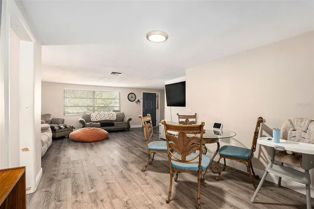 a room with furniture and a flat screen tv