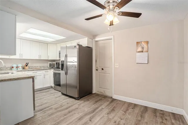 a kitchen with a refrigerator a sink and dishwasher
