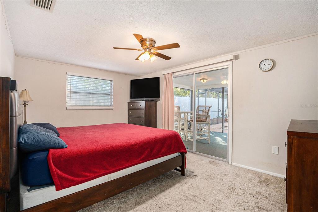 6406 Pawling Avenue Port Richey, FL 34668 - Photo 20 of 28 a bedroom with a bed and a window