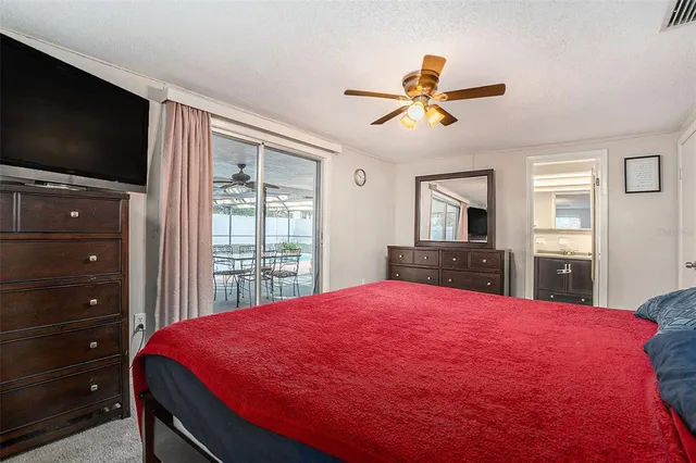 a bed room with a bed and a flat screen tv