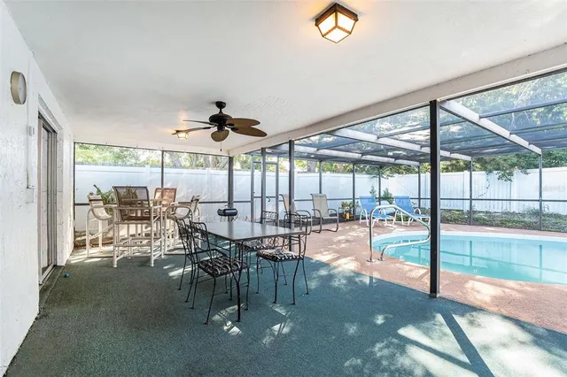 a view of a dining room with furniture water view and balcony