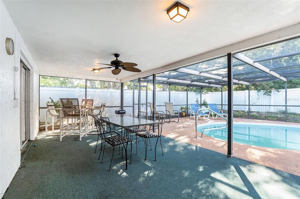 6406 Pawling Avenue Port Richey, FL 34668 - Photo 24 of 28 a view of a dining room with furniture water view and balcony