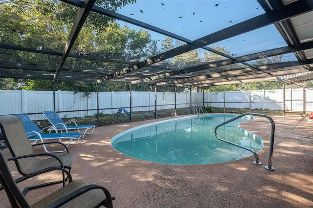 a view of a swimming pool with a patio