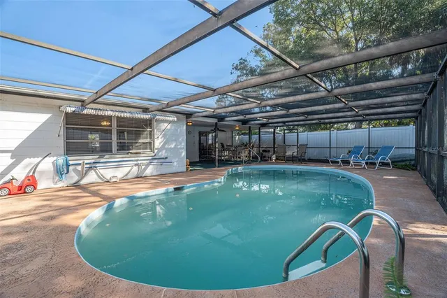 a view of a swimming pool with a patio