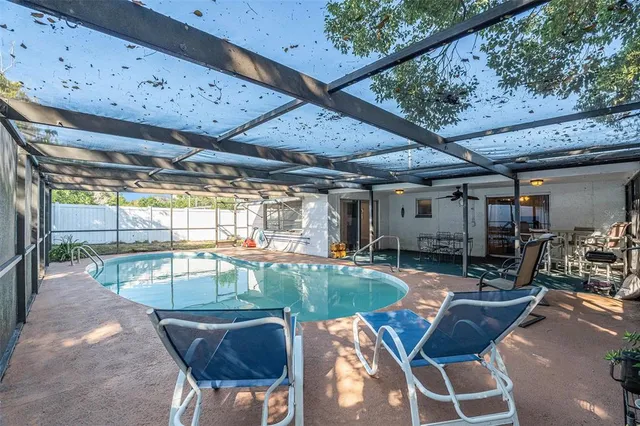 a view of a swimming pool with a patio