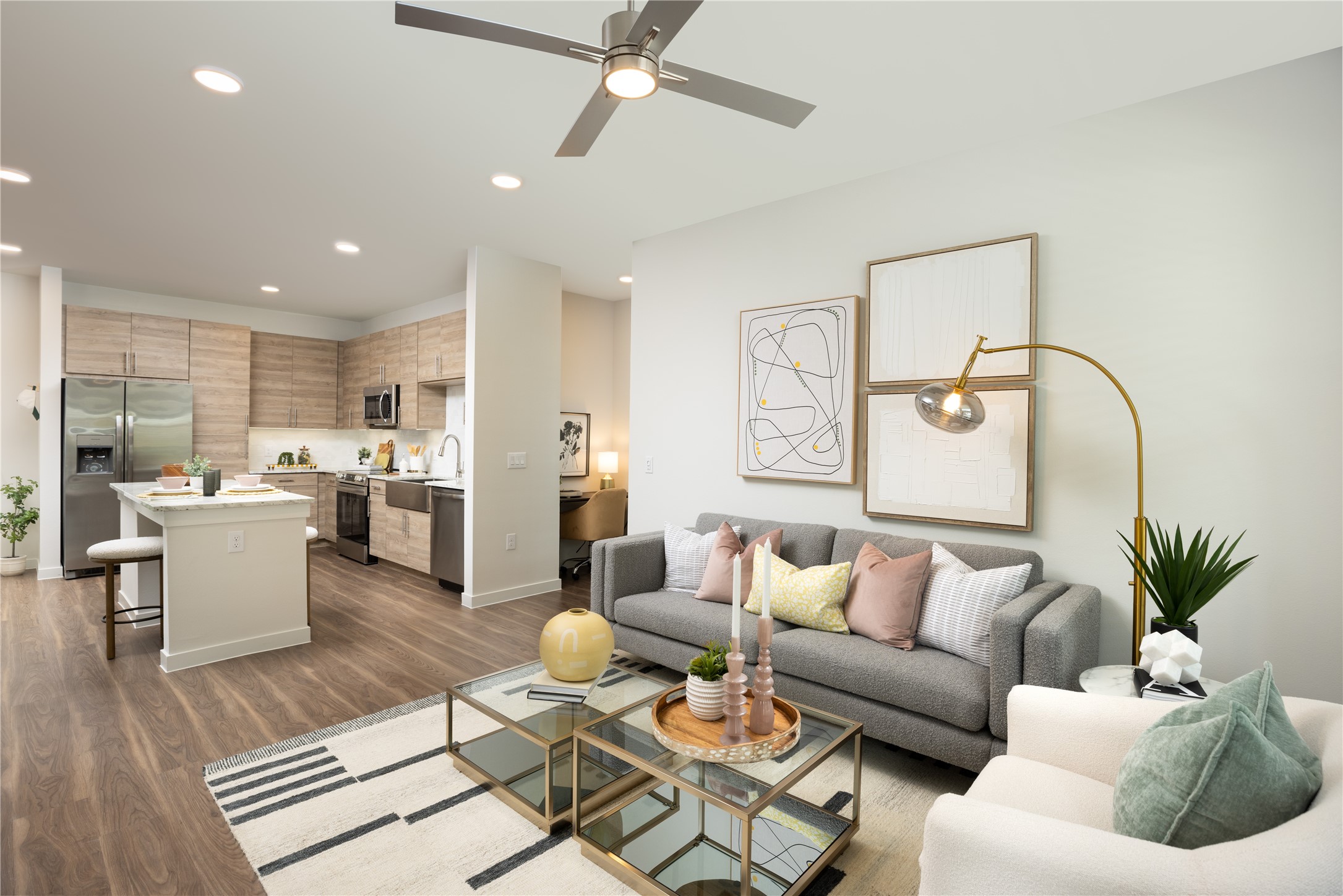 9302 Fry Road, Unit B2Y618 Cypress, TX 77433 - Photo 5 of 14 a living room with furniture kitchen view and a potted plant
