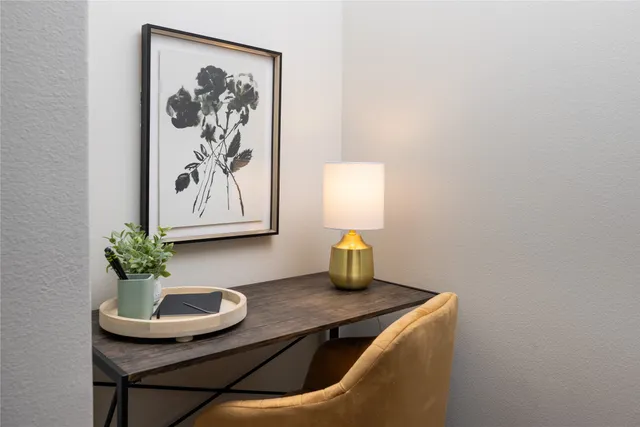 a room with table and flowerpot