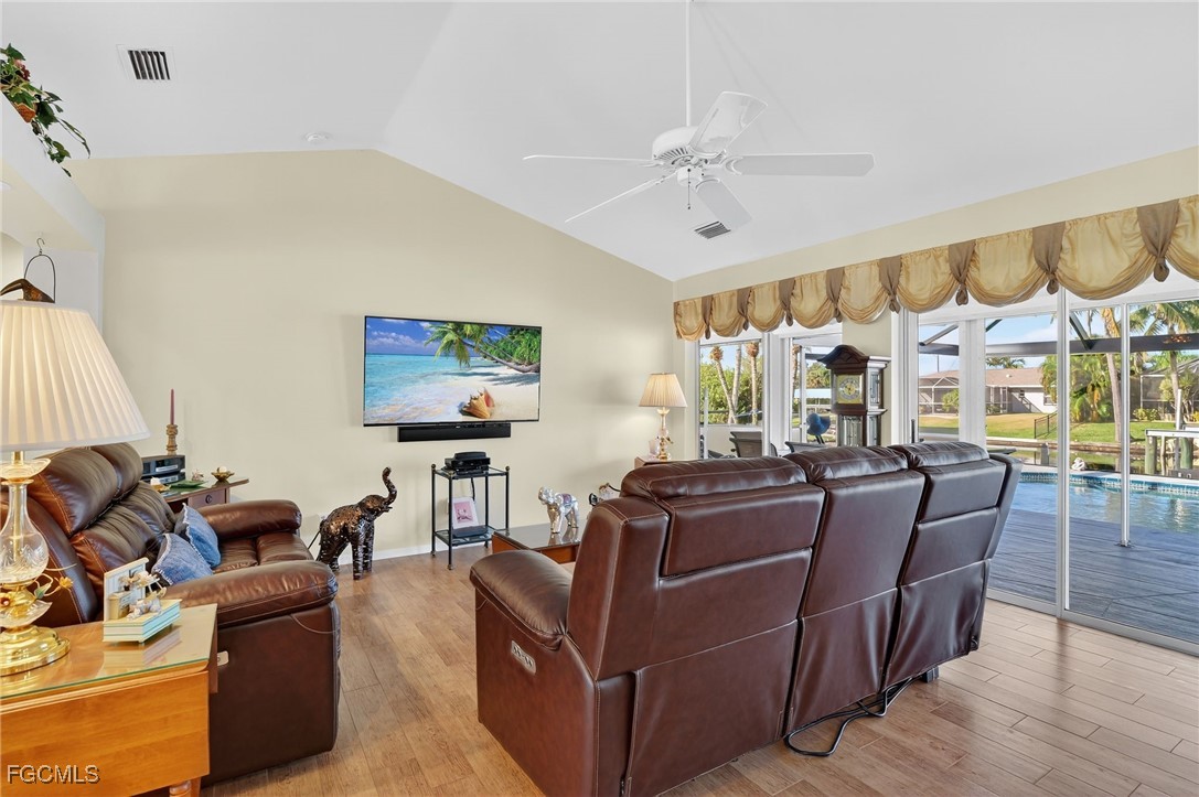 4306 Southwest 3rd Avenue Cape Coral, FL 33914 - Photo 7 of 50 a living room with furniture and a flat screen tv