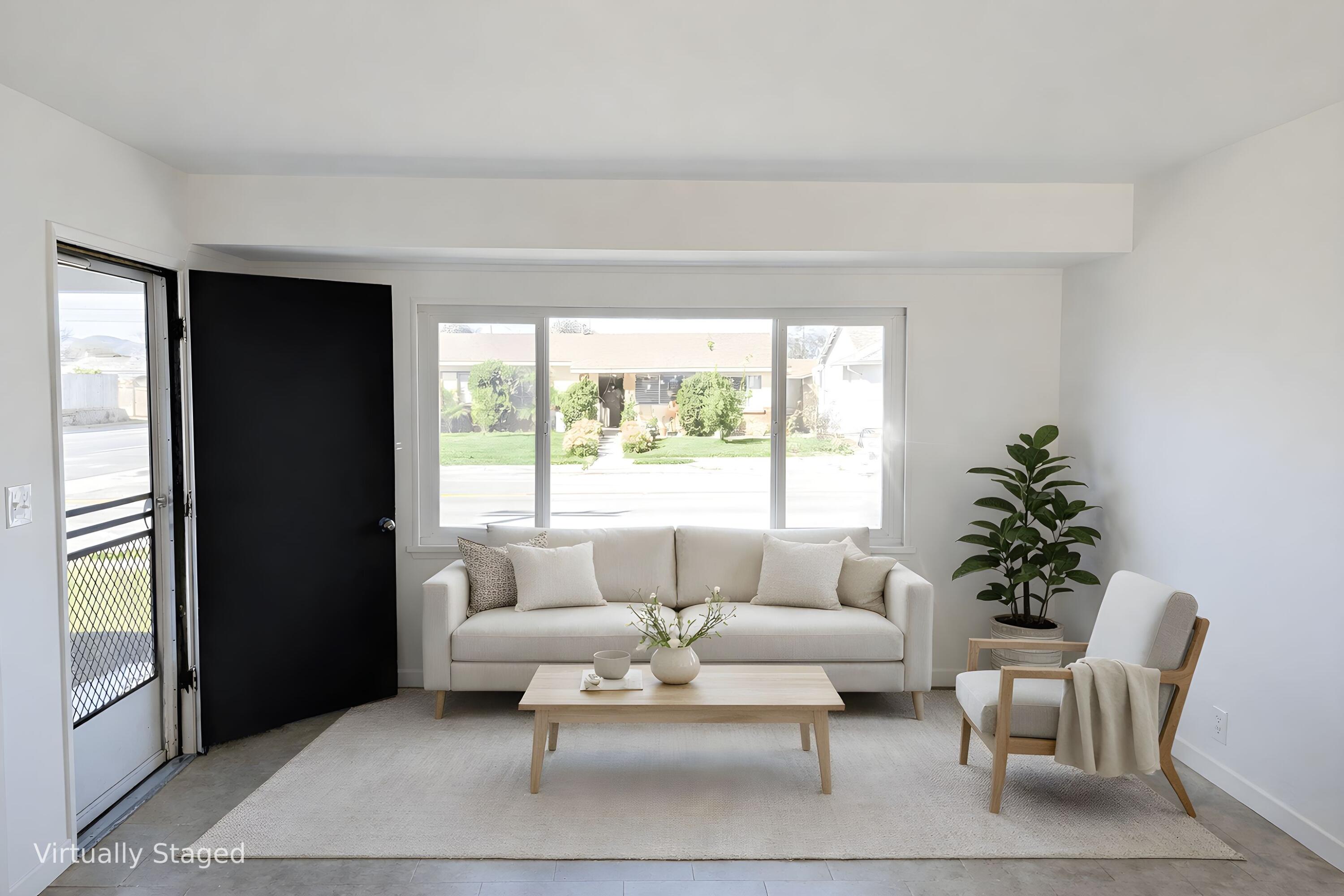 1100 North Third Street Lompoc, CA 93436 - Photo 2 of 12 a living room with furniture and a large window