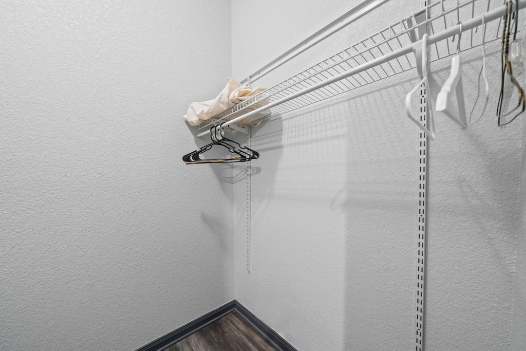 209 Lakeview Circle Spring Branch, TX 78070 - Photo 25 of 40 Spacious closet featuring dark wood-style floors