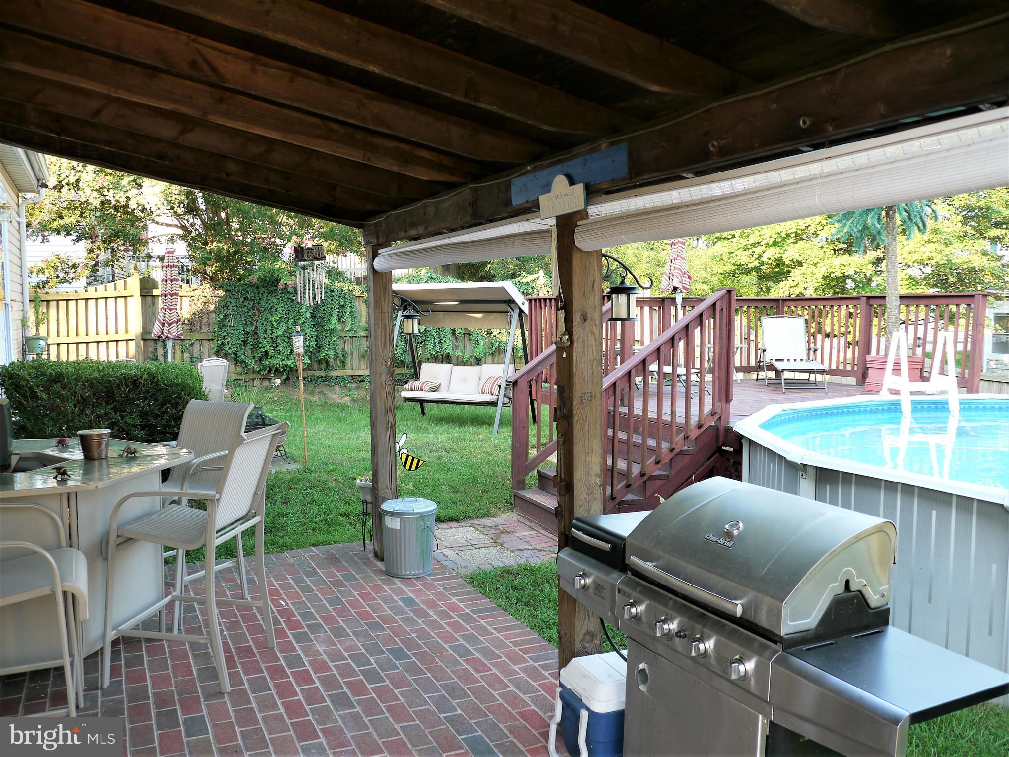 428 Madingley Road Linthicum Heights, MD 21090 - Photo 13 of 14 Patio, glider, pool with deck!